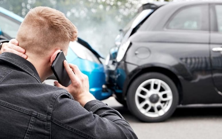 2. Call 911 and Report the Accident