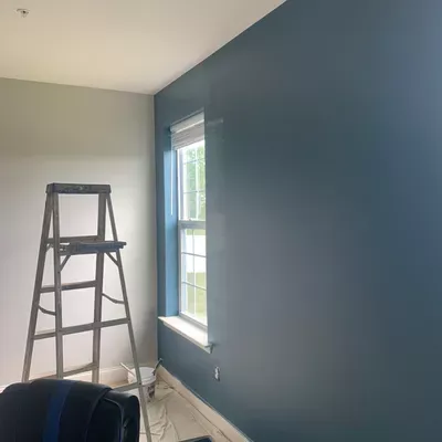 Edwin and son painting drywall and plastering