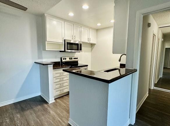 Woodbriar Apartments - 10415 Paramount Blvd - Downey, CA Apartments for Rent